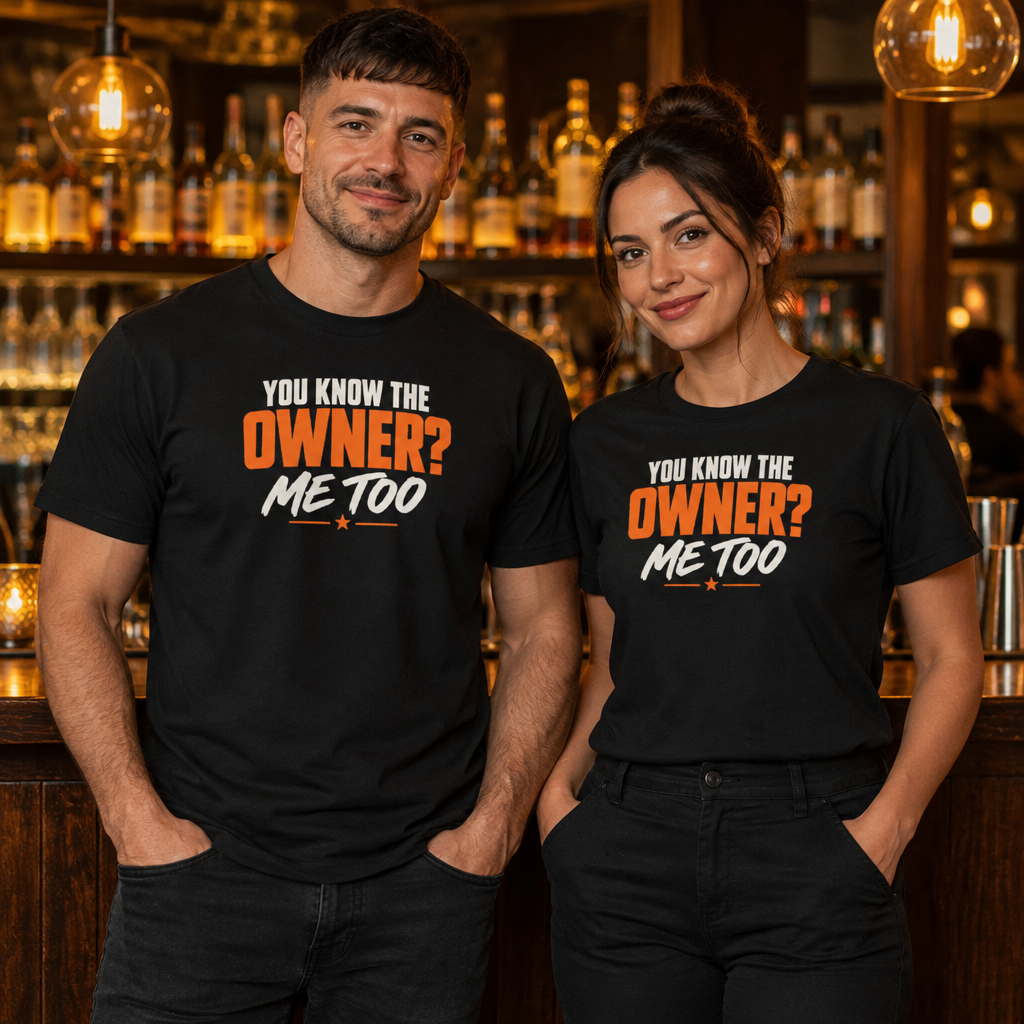 You Know the Owner? Me Too tee worn by two bar staff behind a cocktail bar