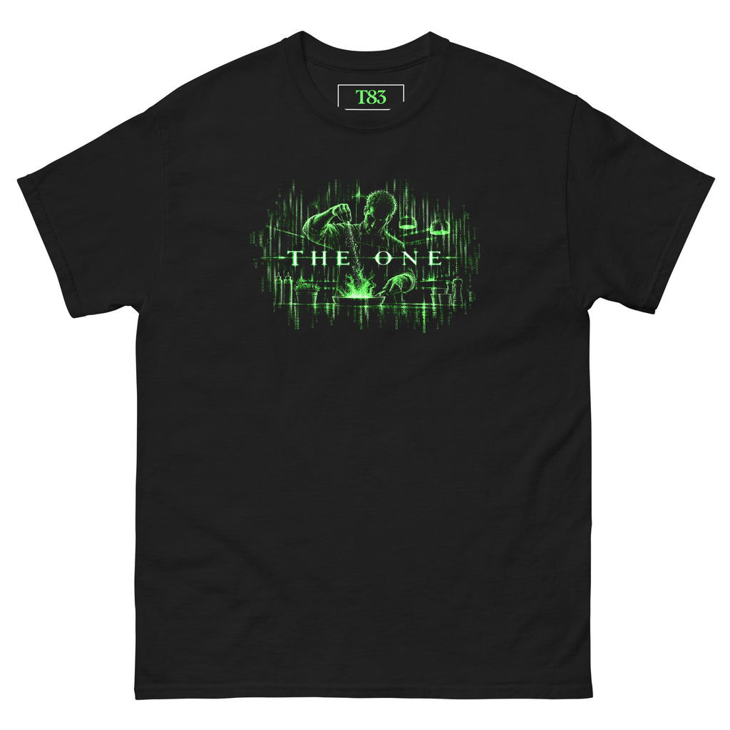 The One Chef tee, black, front: chef seasoning a flaming pan, drawn in falling green digital code, with glowing THE ONE lettering