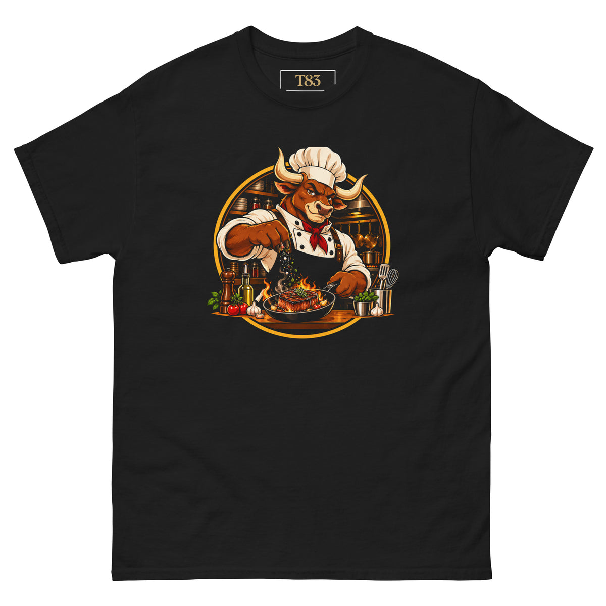 Bull in the Kitchen tee, black, front: illustration of a bull chef in a toque and red neckerchief seasoning a flaming steak in a pan, framed by a gold circle with a kitchen behind